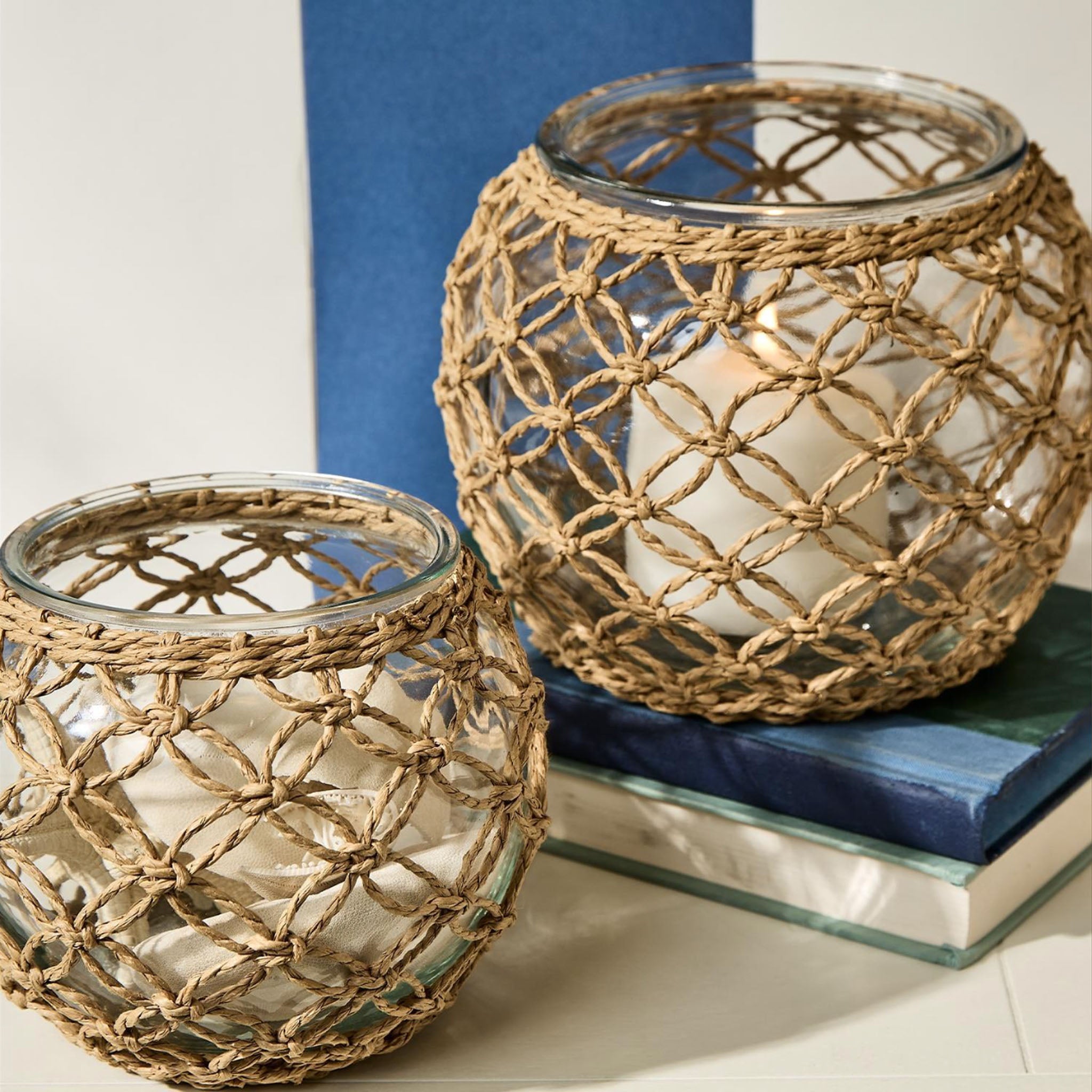Lattice Wrapped Votive - Small and large on a table at Addison West