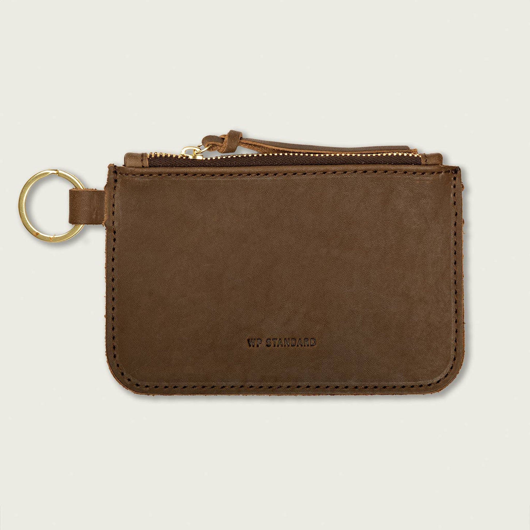 Leather Zip Key Pouch on a beige background at Addison West