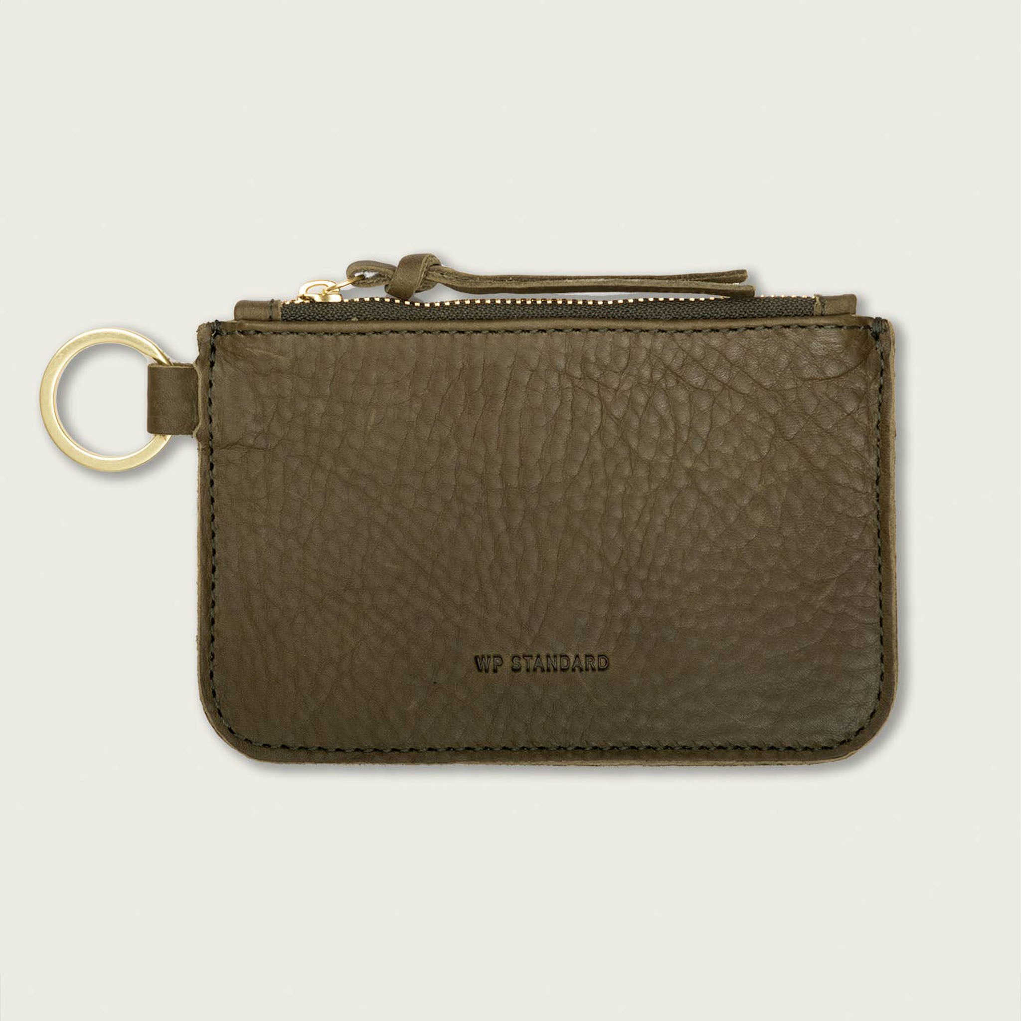 Leather Zip Key Pouch on a beige background at Addison West