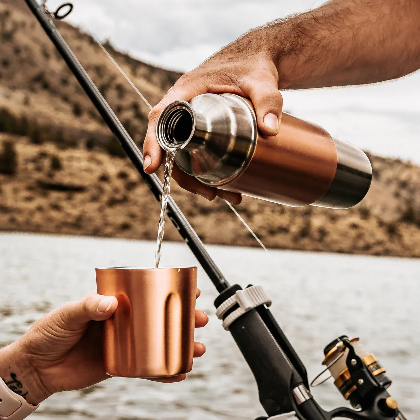 High Camp Firelight Flask in Copper at the lake at Addison West