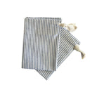 Striped linen bread bags on a white background