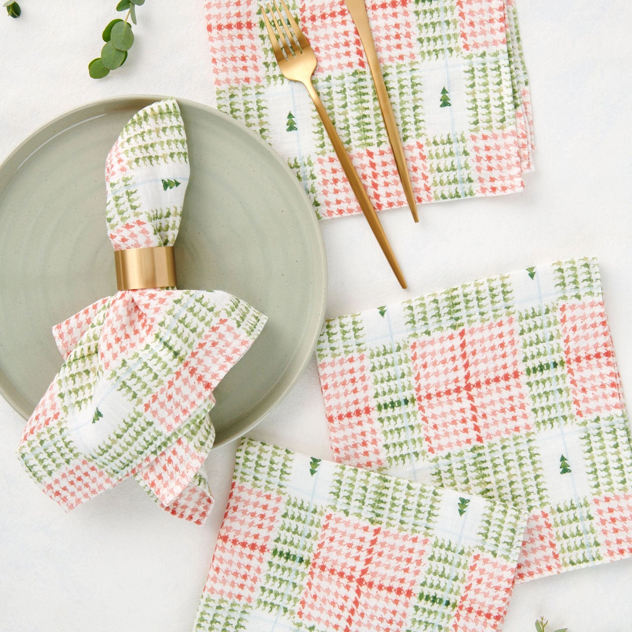 Linen Dinner Napkins in Xmas Plaid on a white table at Addison West