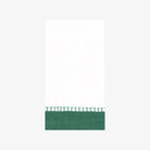 Caspari paper Guest napkin with border on a white background