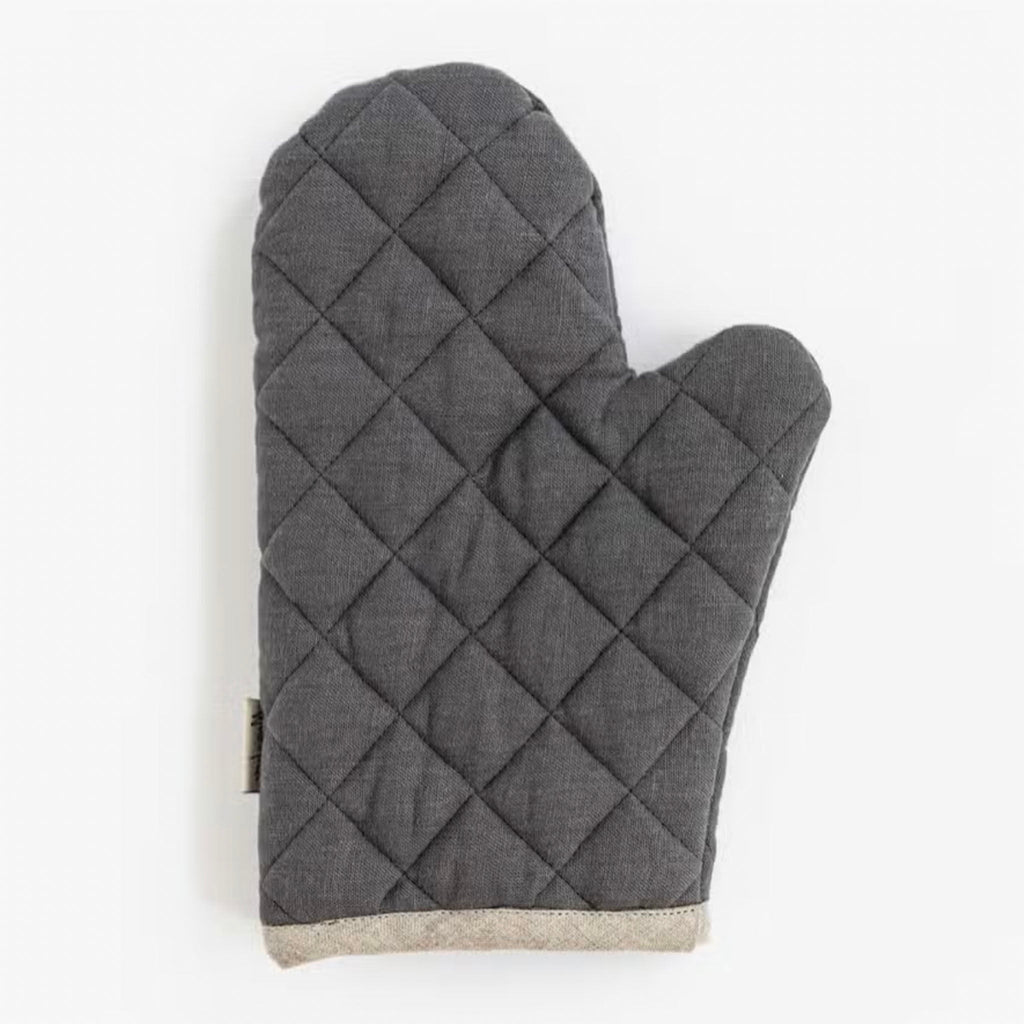 Quilted charcoal grey linen oven mitt on a white background