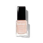 Bottle of London Town linen nail polish on a white background