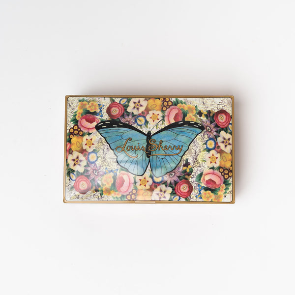 Louis Sherry butterfly tin of 12 chocolates with colorful box designed by John Derian on a white background