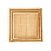 Stack of three square rattan trays with brass corners on a white background