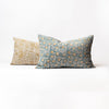 Long lumbar pillow with ochre yellow botanical print with blue printed pillow on a white background