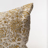 Close up of Long lumbar pillow with ochre yellow botanical print on a white background