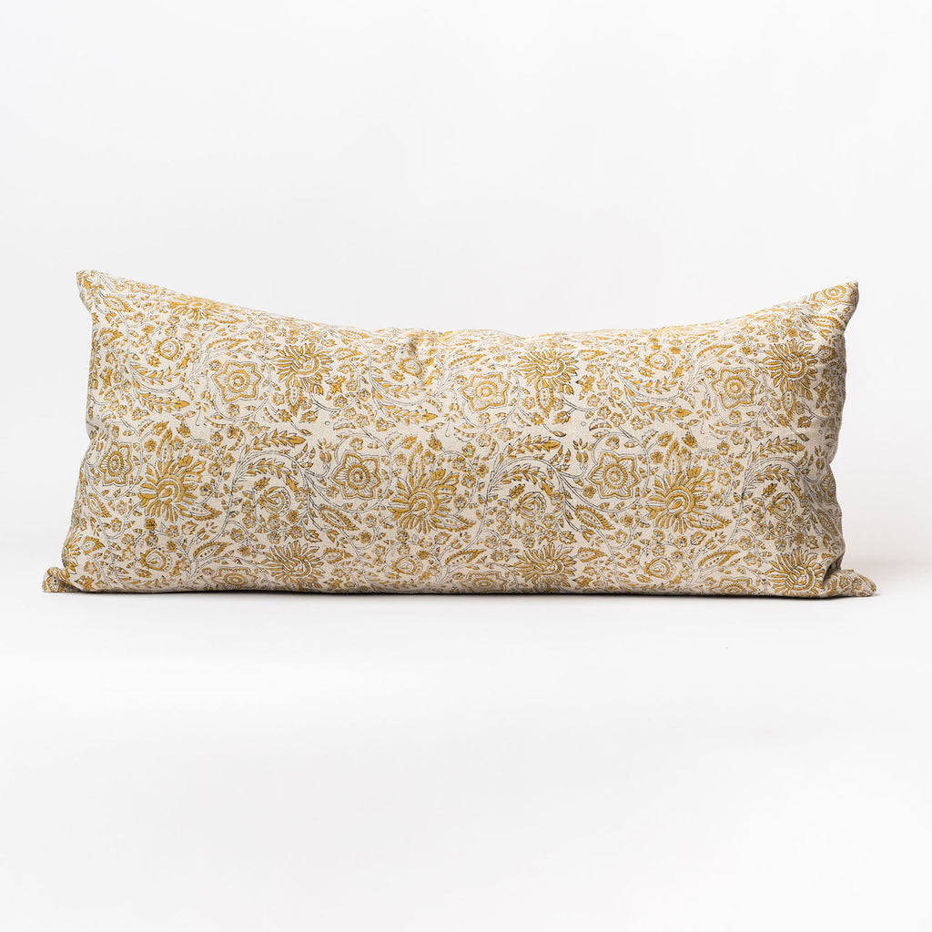 Long lumbar pillow with ochre yellow botanical print on a white background