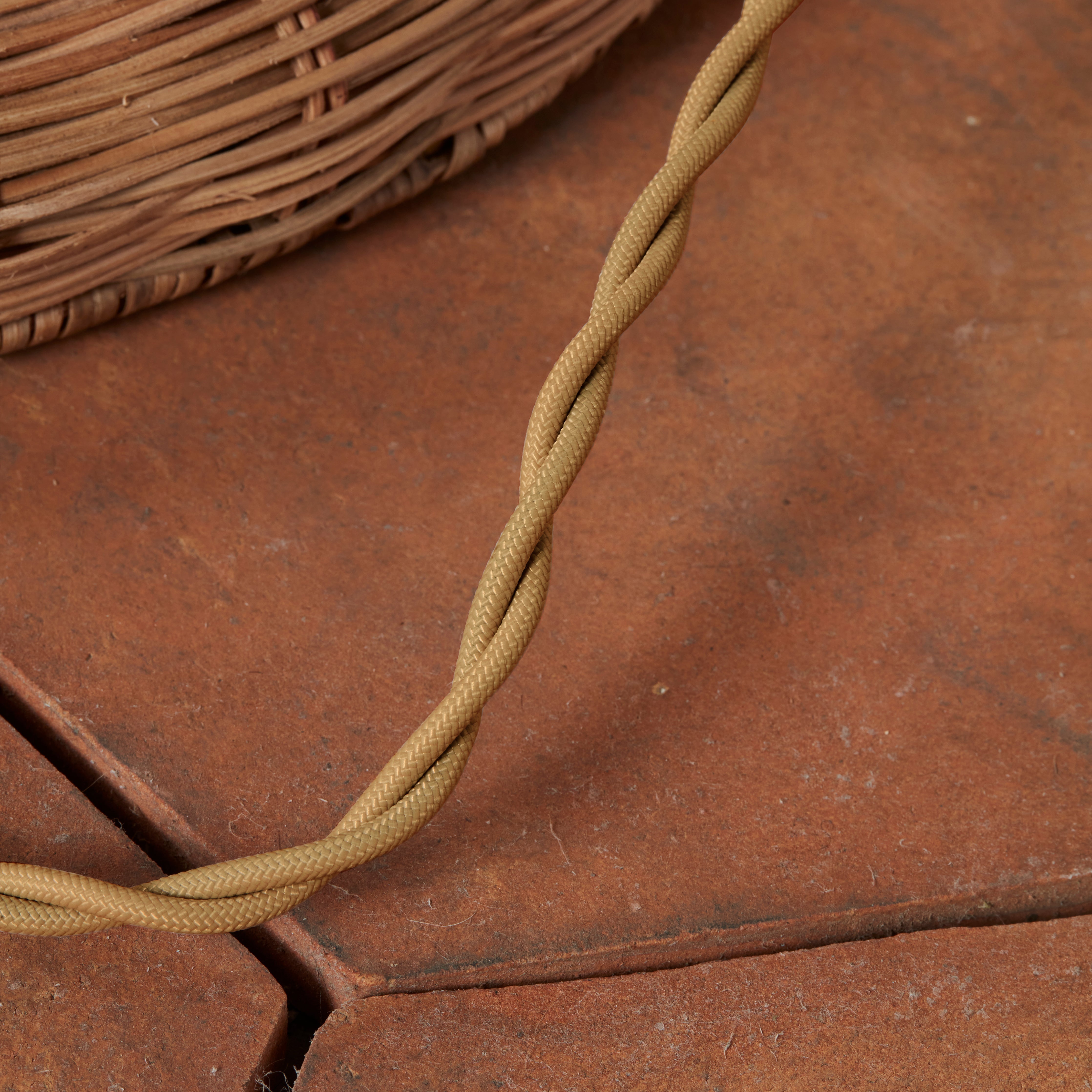 Close up of Woven Augusta Floor Lamp on a beige background at Addison West
