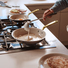 Made In CeramiClad™ 12” Non-stick Fry Pan in Antique Brass on a stove at Addison West