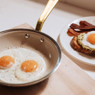 Made In CeramiClad™ 8” Non-stick Fry Pan in Antique Brass on a table at Addison West
