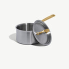 Made In Stainless Clad 2 qt. Saucepan with Lid in Antique Brass on a white background at Addison West