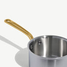 Made In Stainless Clad 2 qt. Saucepan with Lid in Antique Brass on a white background at Addison West