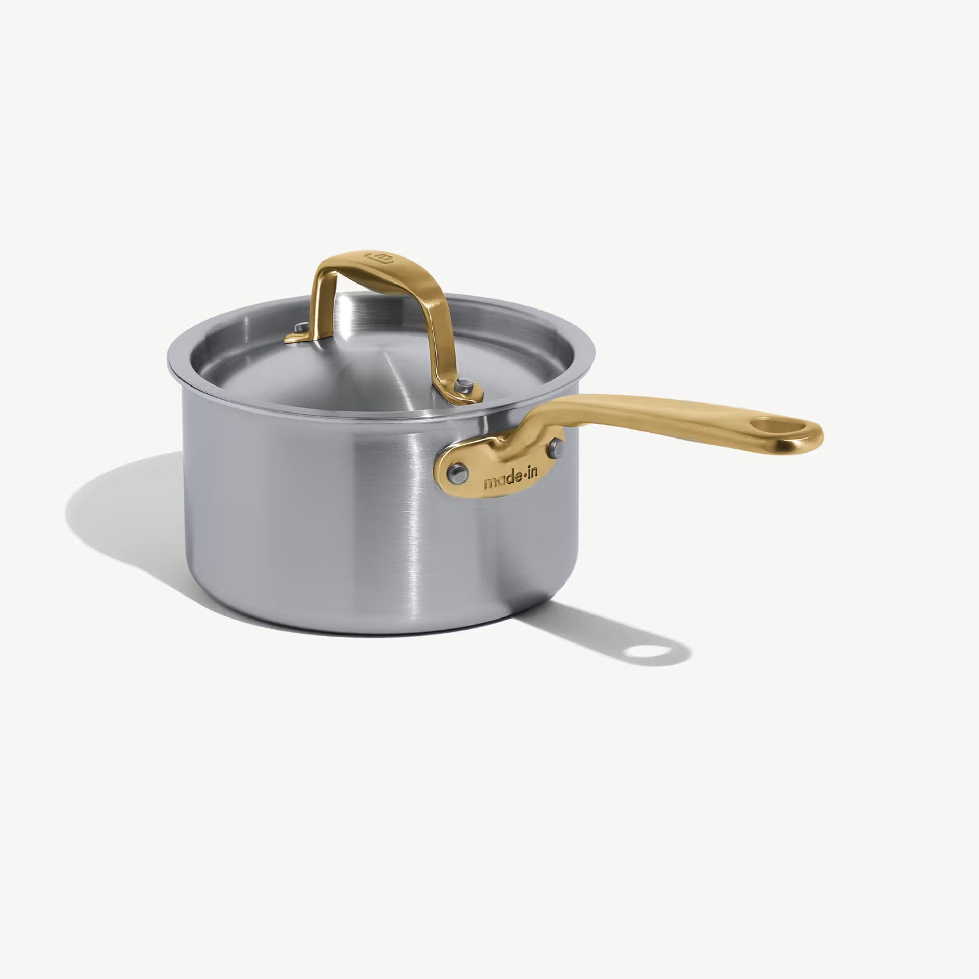 Made In Stainless Clad 2 qt. Saucepan with Lid in Antique Brass on a white background at Addison West