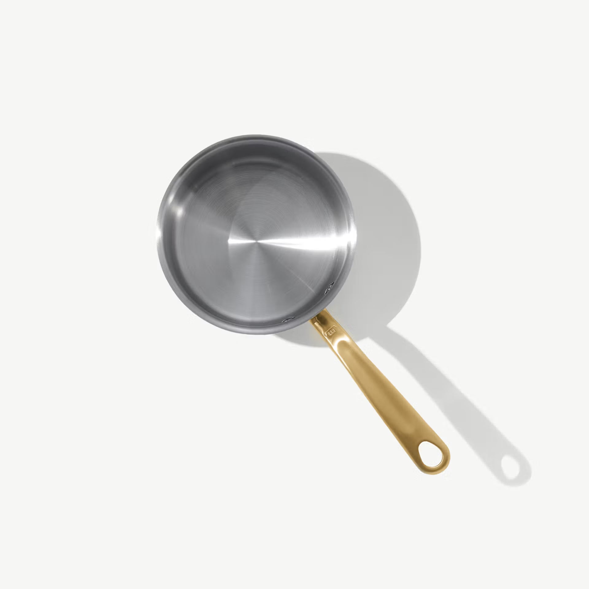 Made In Stainless Clad 2 qt. Saucepan with Lid in Antique Brass on a white background at Addison West