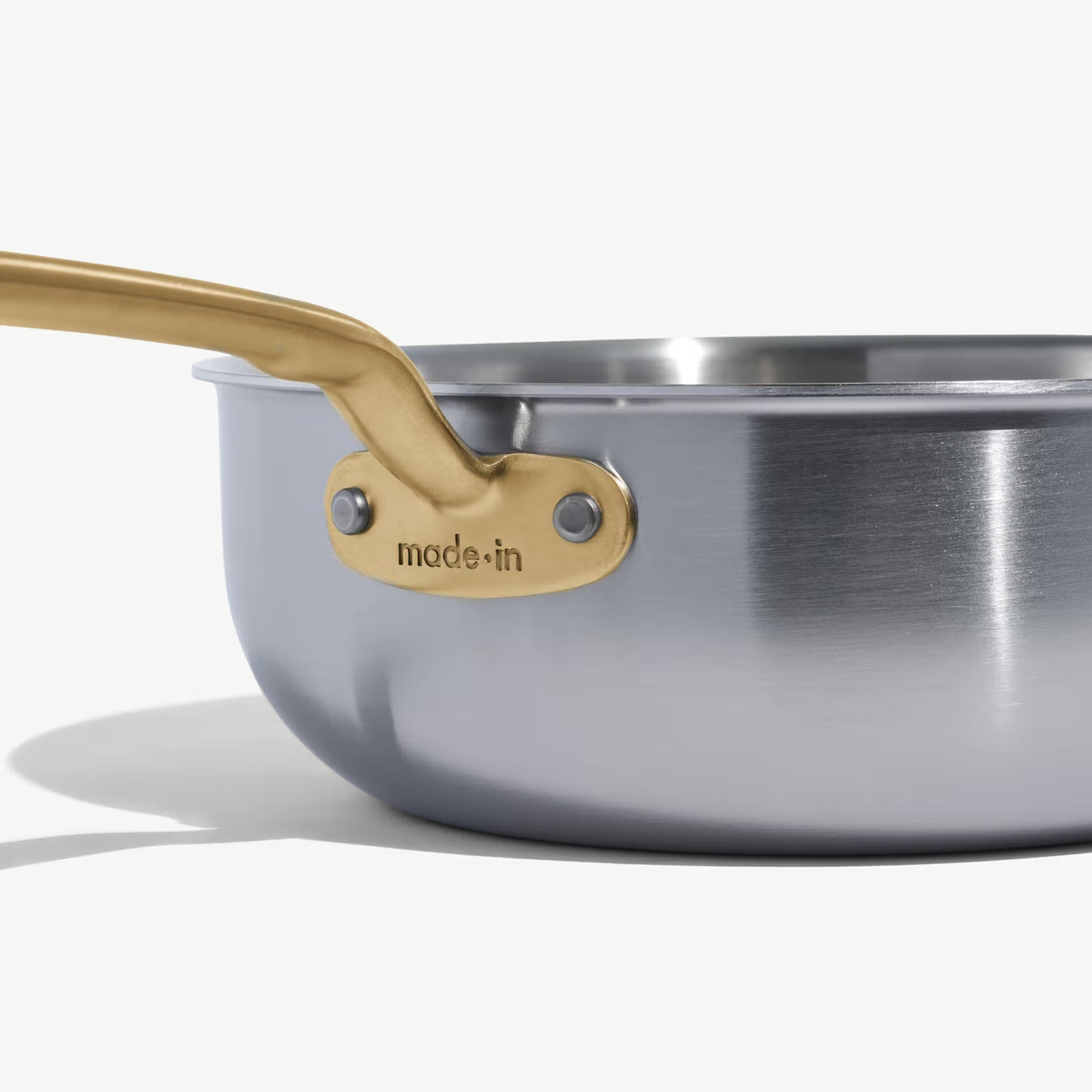 Made In Stainless Clad 3 qt. Saucier with Lid in Antique Brass on a white background at Addison West