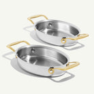 Made In Stainless Steel Gratin Dishes in Antiqued Brass, Set of 2 on plain background.