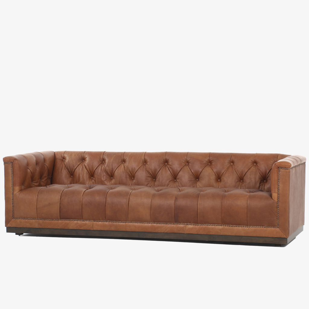 Four Hands furniture brand Maxx Chesterfield style Sofa in Heirloom Sienna leather on a white background