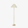 Simple brass floor lamp with white shade on a white background