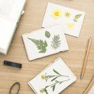Pocket Flower Press Smock on a table at Addison West