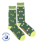 A pair of green men's socks with pickleball-themed patterns including pickleball paddles, balls, and court lines. The socks have ' PURPOSELY MISMATCHED ' text on the side.