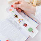 Nature Rainbow Cross Stitch Bookmark Kit in a book at Addison West