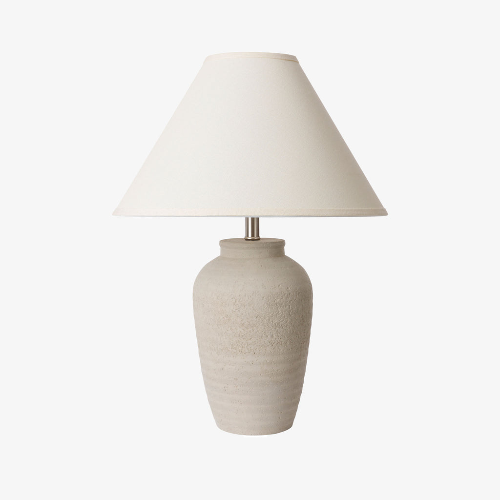 Surya brand grey concrete Navagio lamp on a white background