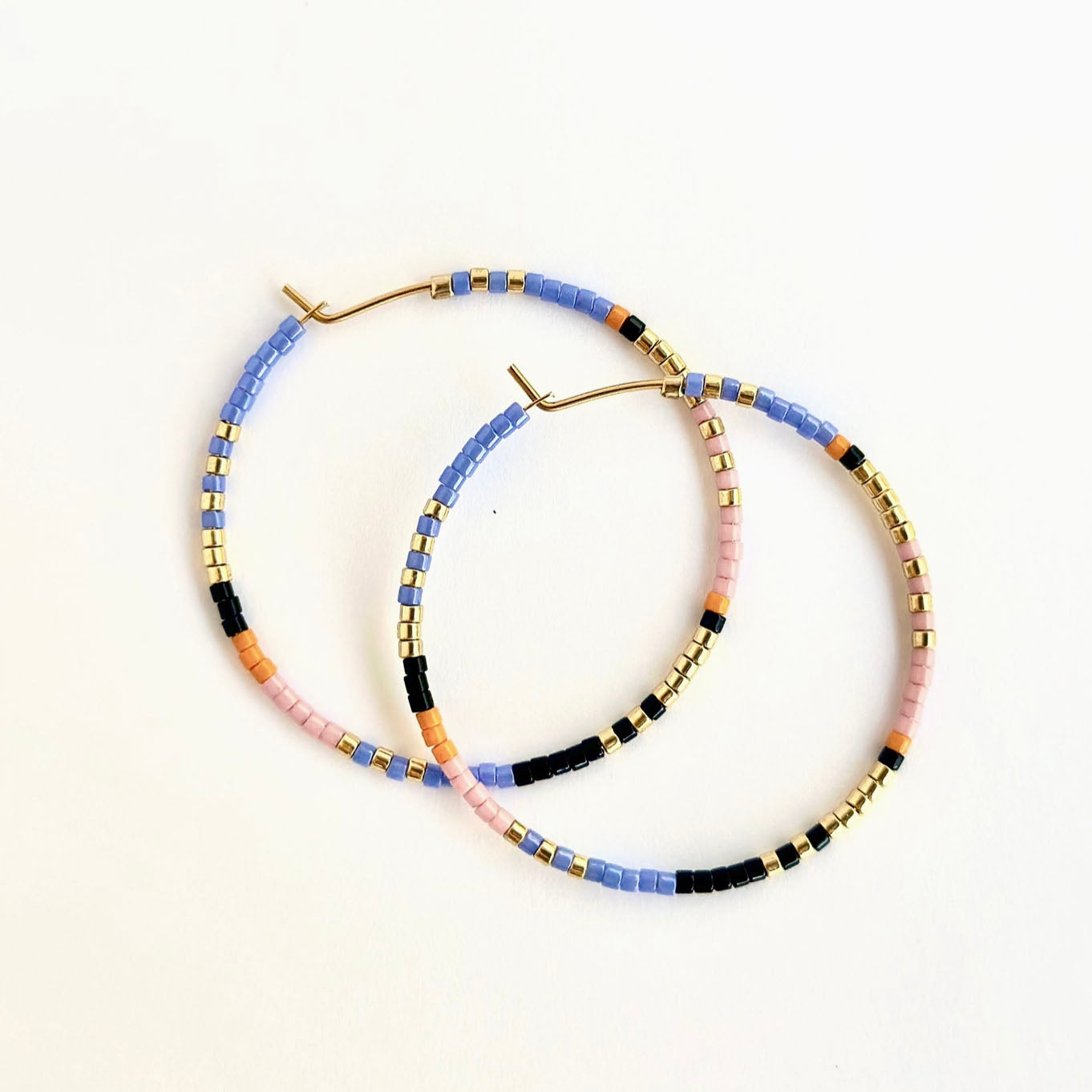 Ocean Breakup Large Beaded Hoop Earrings in Amazon on white background at the Addison West.