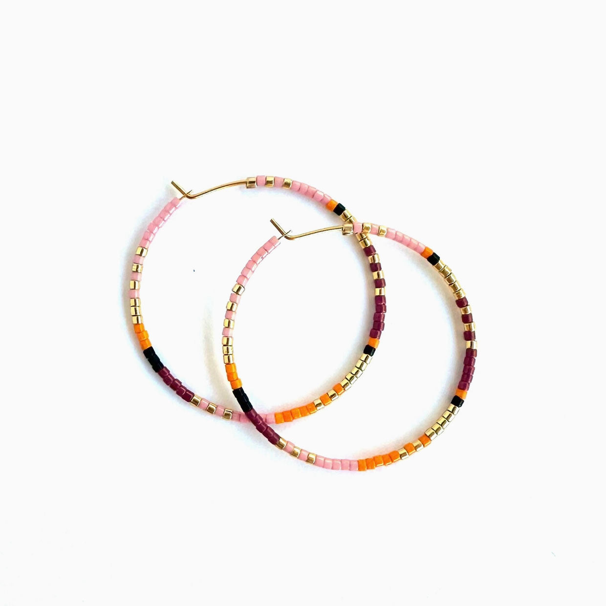 Ocean Breakup Large Beaded Hoop Earrings in Hibiscus on white background at the Addison West.