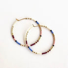 Ocean Breakup Large Beaded Hoop Earrings in Orchid on white background at the Addison West.