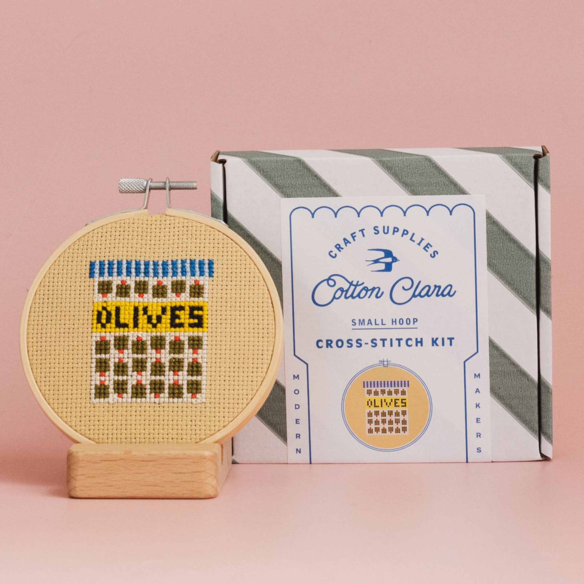 Olives Cross Stitch Kit on a pink background at Addison West