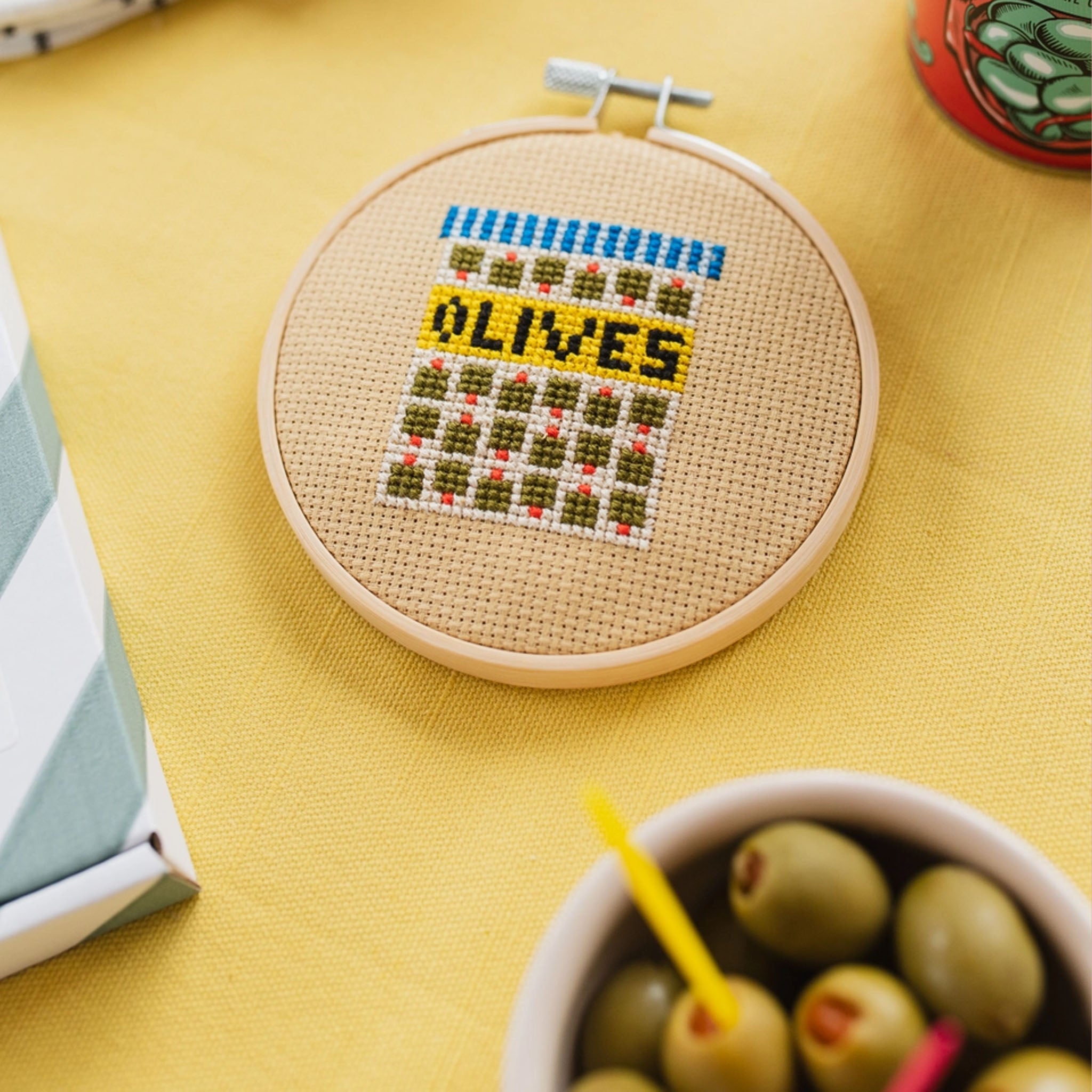 Olives Cross Stitch Kit on a yellow  background at Addison West
