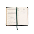 Notebook with green page saver on white background.