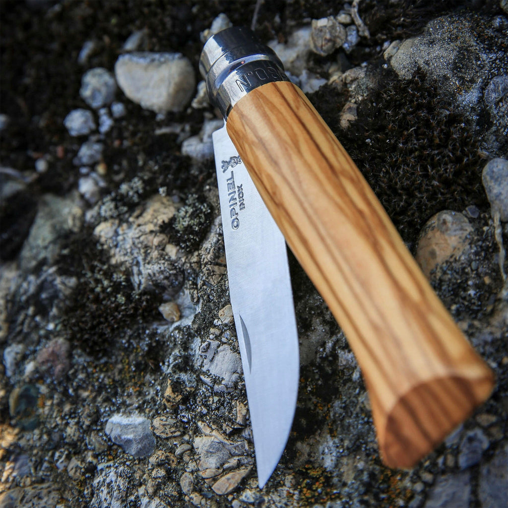 Opinel No.08 Folding Knife on a stone and gravel surface