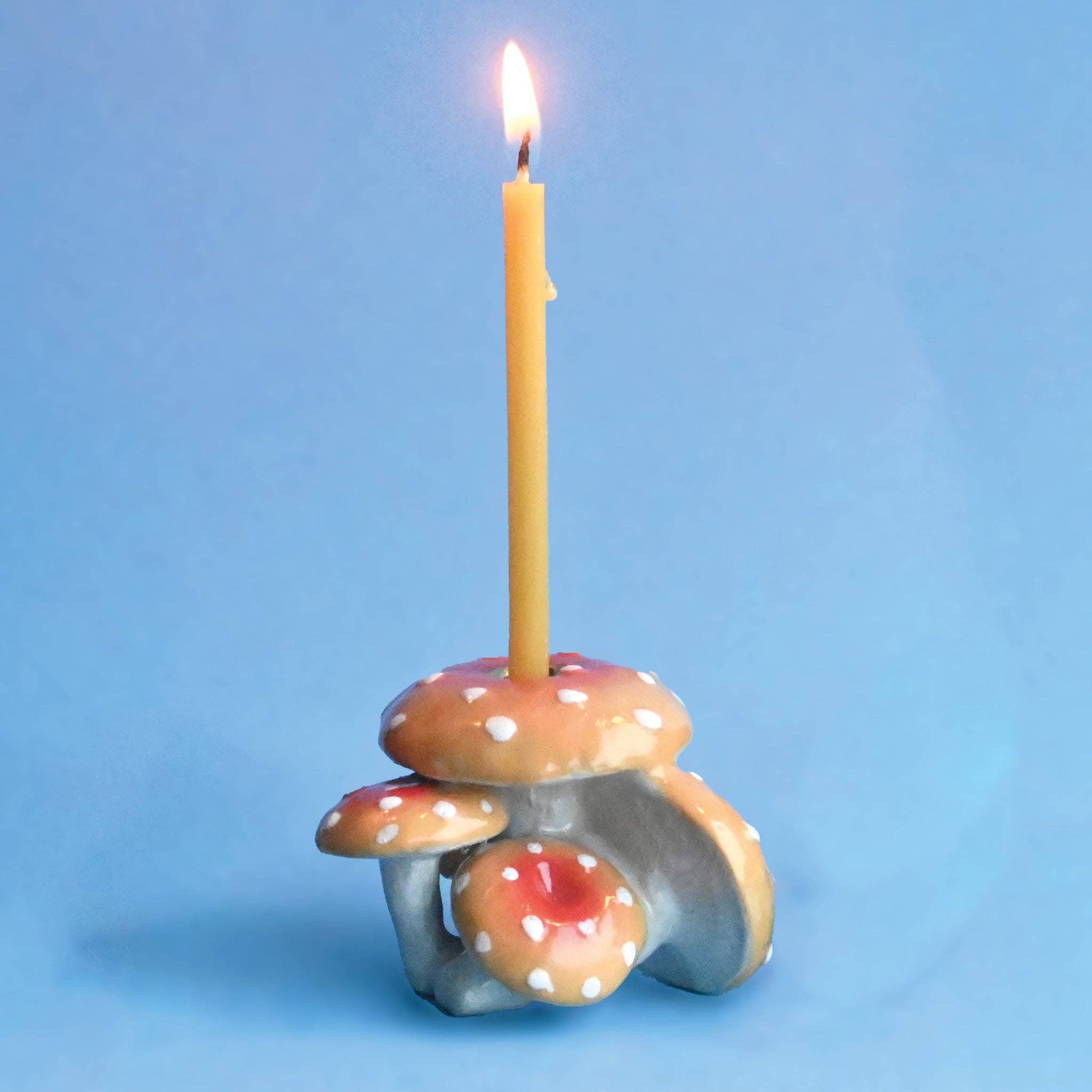 Orange Mushroom Cluster Cake Topper on a blue background