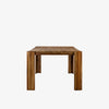 Four Hands Orla farmhouse style dining table in toasted acacia wood on a white background