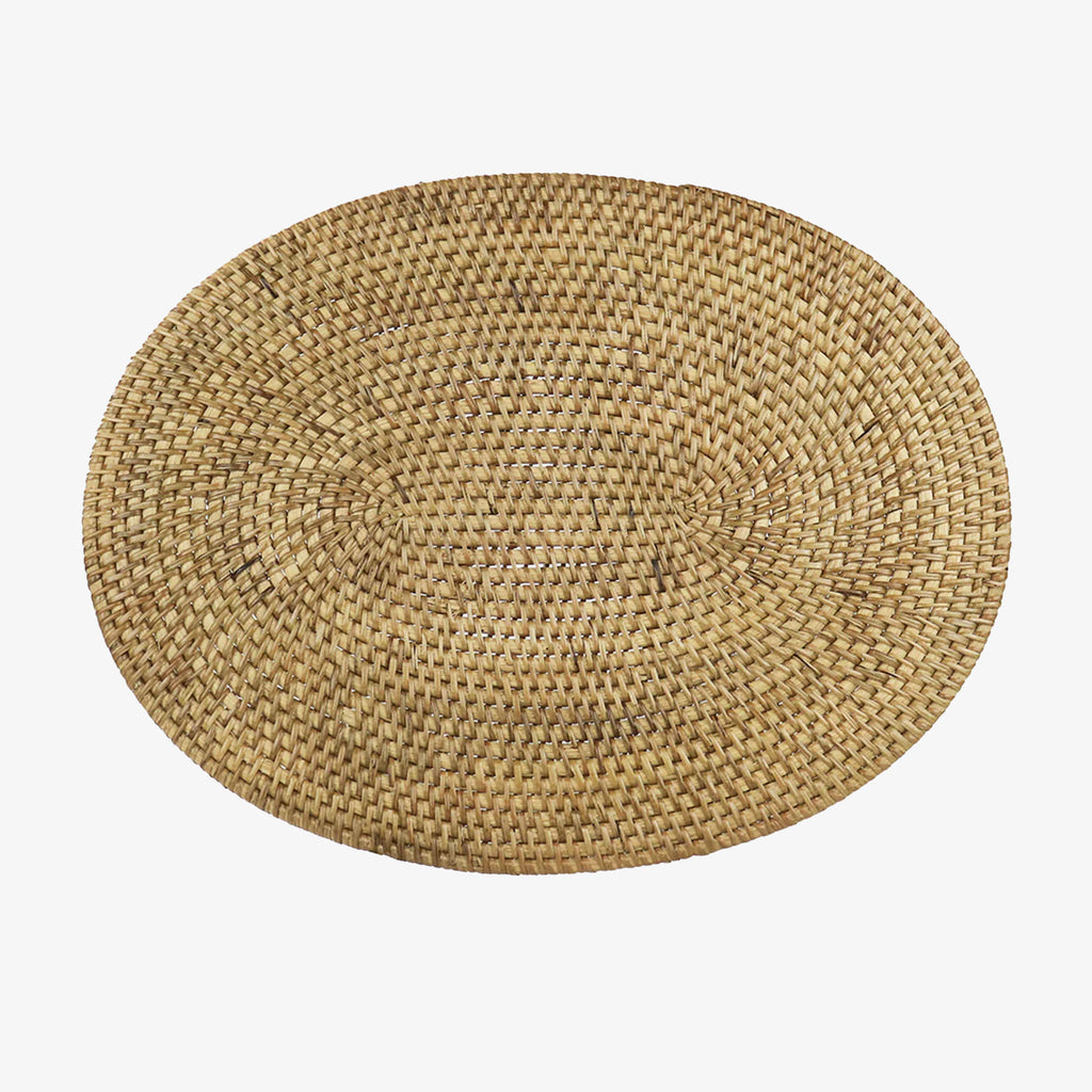 Oval rattan woven placemat on a white background
