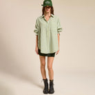 Oversized Gingham Buttom Down in Leaf shown on model on plain background.