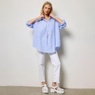 Oversized Gingham Buttom Down in Light Blue shown on model on plain background.