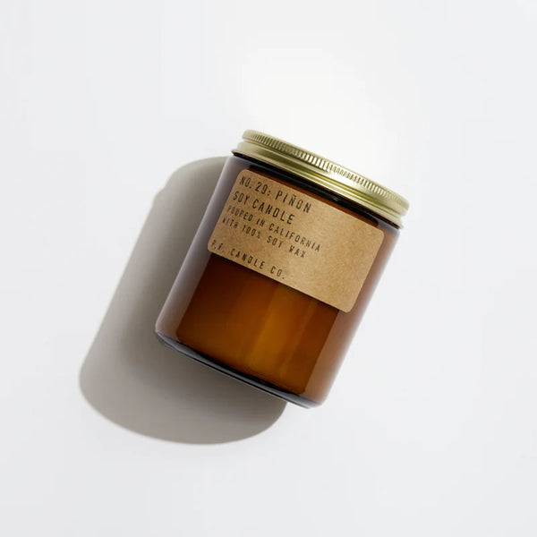 Brown jar of PF Candle Pinon Candle on a white background