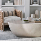 Palecek Vail Outdoor Stone Coffee Table in living room at Addison West.