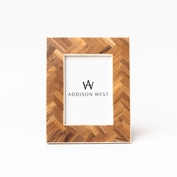 Teak wood picture frame on a white background