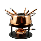 A copper plated stainless steel fondue pot with numbered forks, a black steel rechaud with a base plate, and a removable splatter guard.