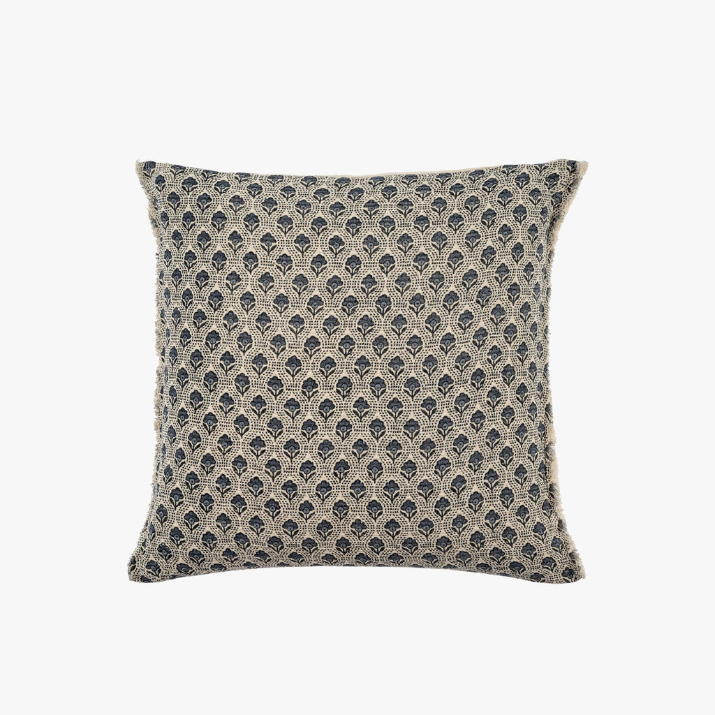 Square pillow with blue and creme patterned block print on a white background