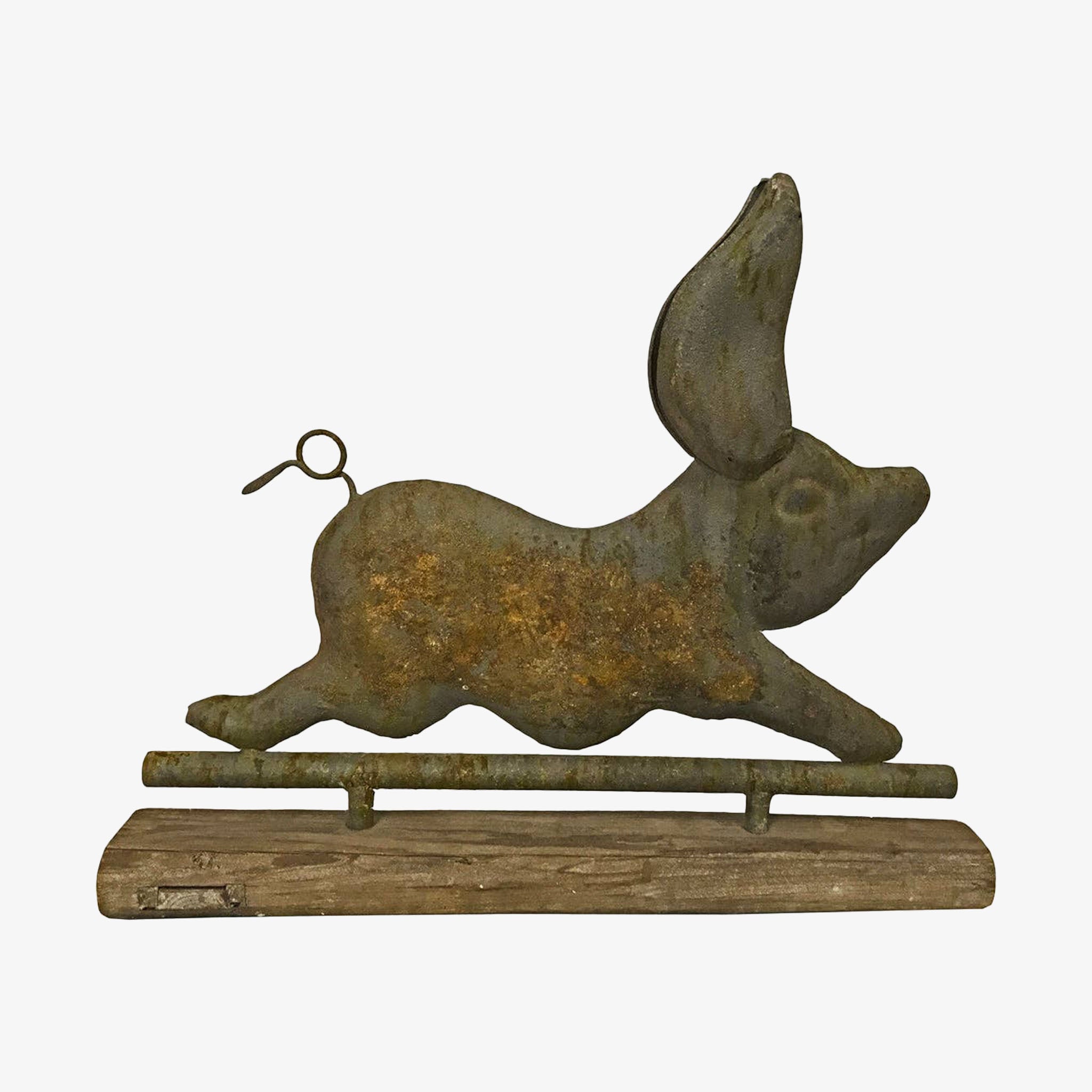 Rustic metal pig-shaped weathervane on a white background
