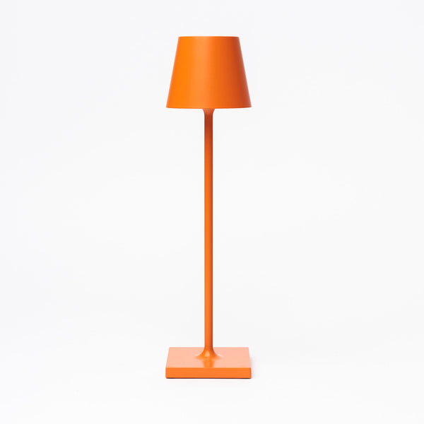 Poldina Pro micro table lamp in orange on a white background