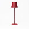 Poldina Pro Table Lamp in Ruby Red on a white background