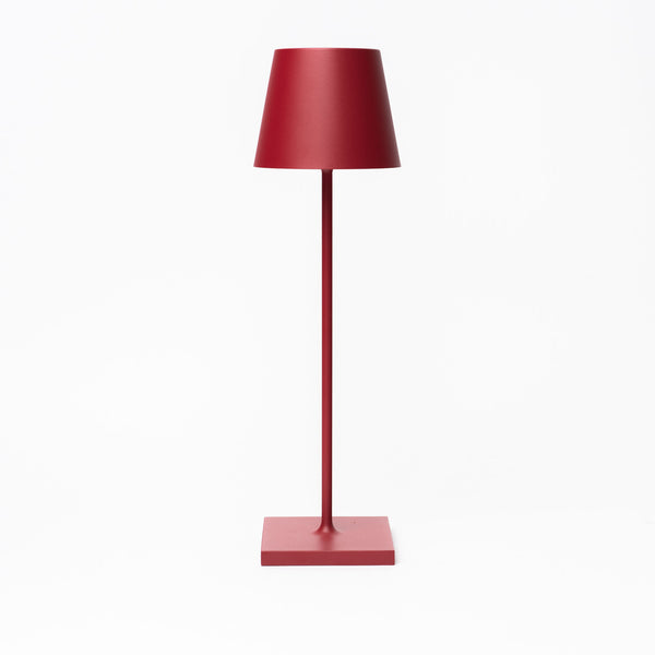 Poldina Pro Table Lamp in Ruby Red on a white background